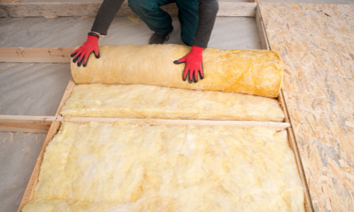 Person installing insulation