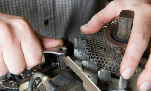 Person working on small engine